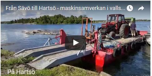 Flatboat moving hay machinery from one island to another