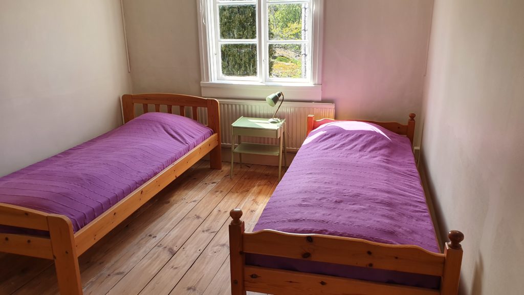 Photo showing room three with two beds.